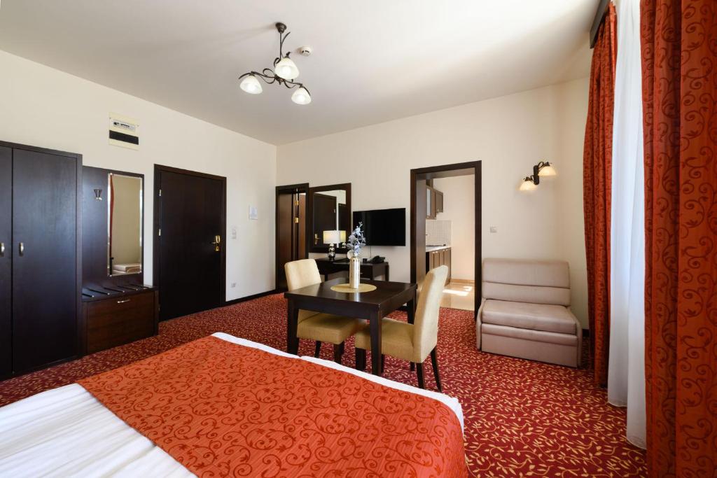 Posteľ alebo postele v izbe v ubytovaní Hotel Aurum