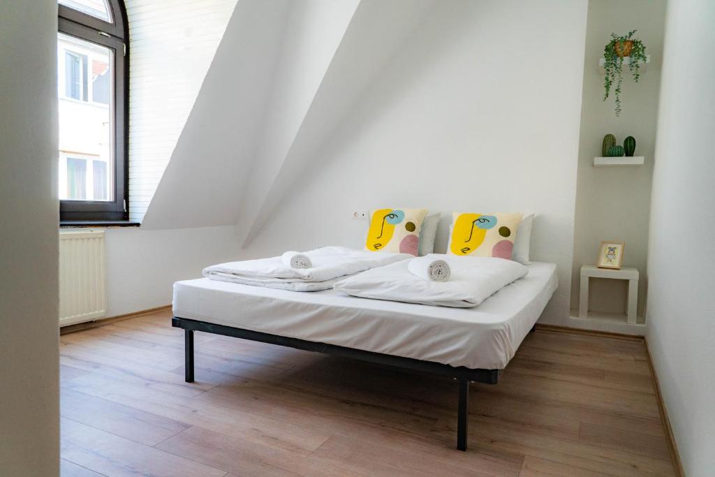 Postel nebo postele na pokoji v ubytování Equity Point Budapest