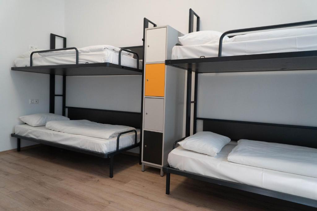 Postel nebo postele na pokoji v ubytování Equity Point Budapest
