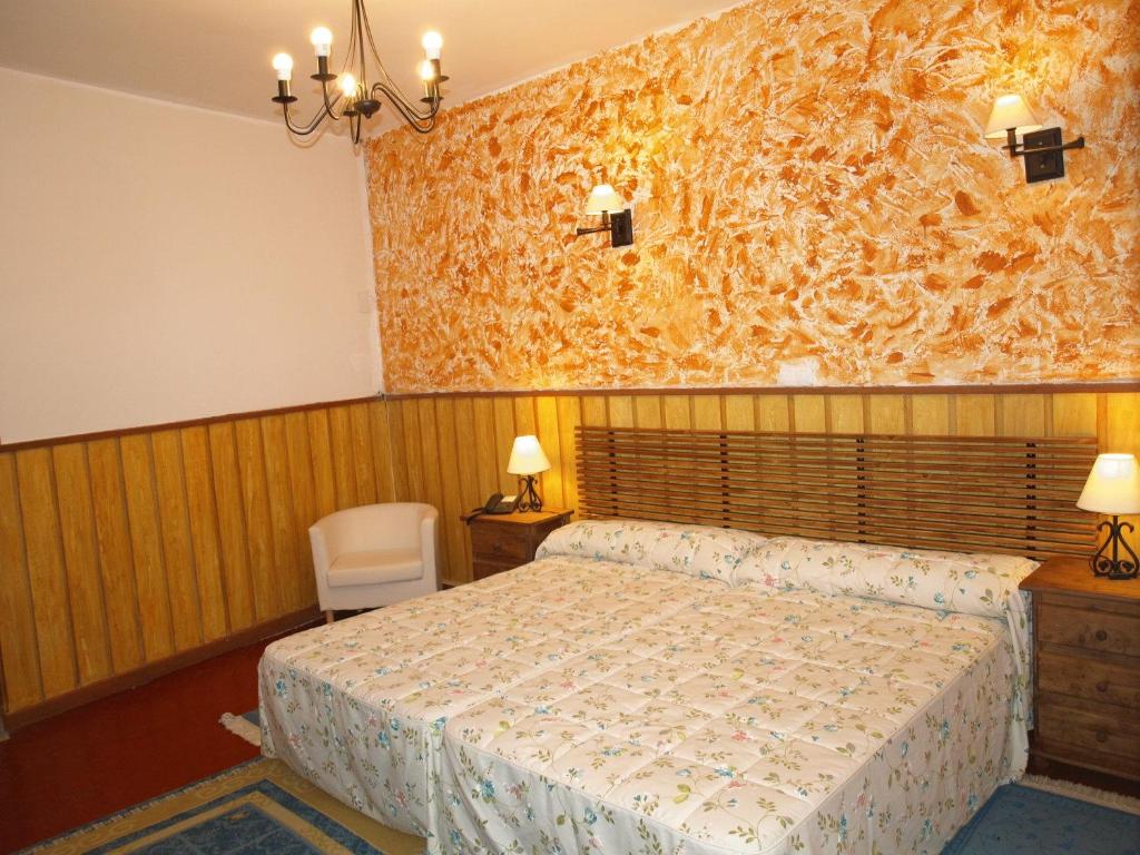 Postel nebo postele na pokoji v ubytování Gran Posada La Mesnada