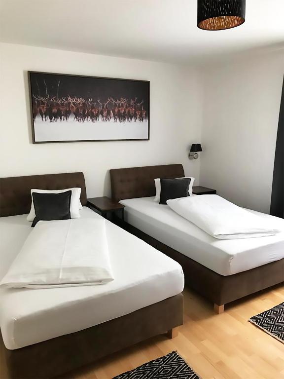 Postel nebo postele na pokoji v ubytování Der Torwirt Radstadt