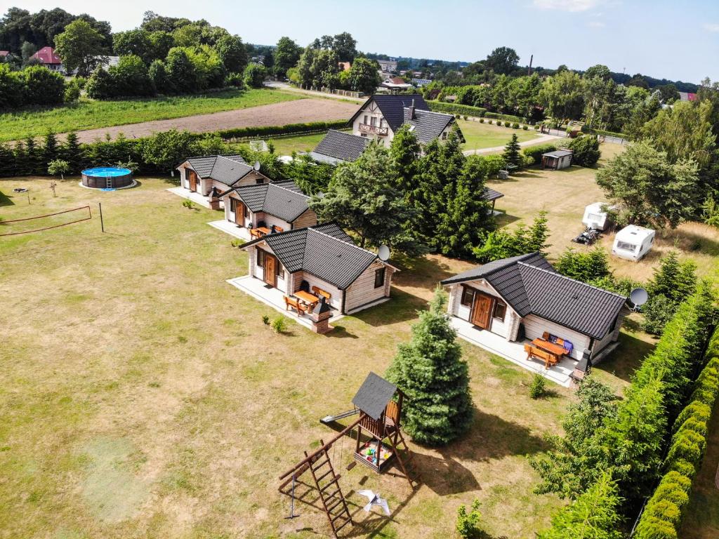 an aerial view of a group of cottages at Domki Kaktus in Osieki