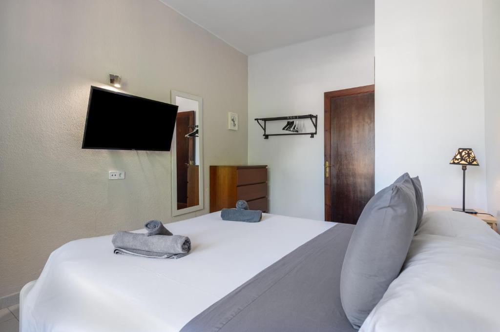 Postel nebo postele na pokoji v ubytování Seafront Apartment in Port Sóller