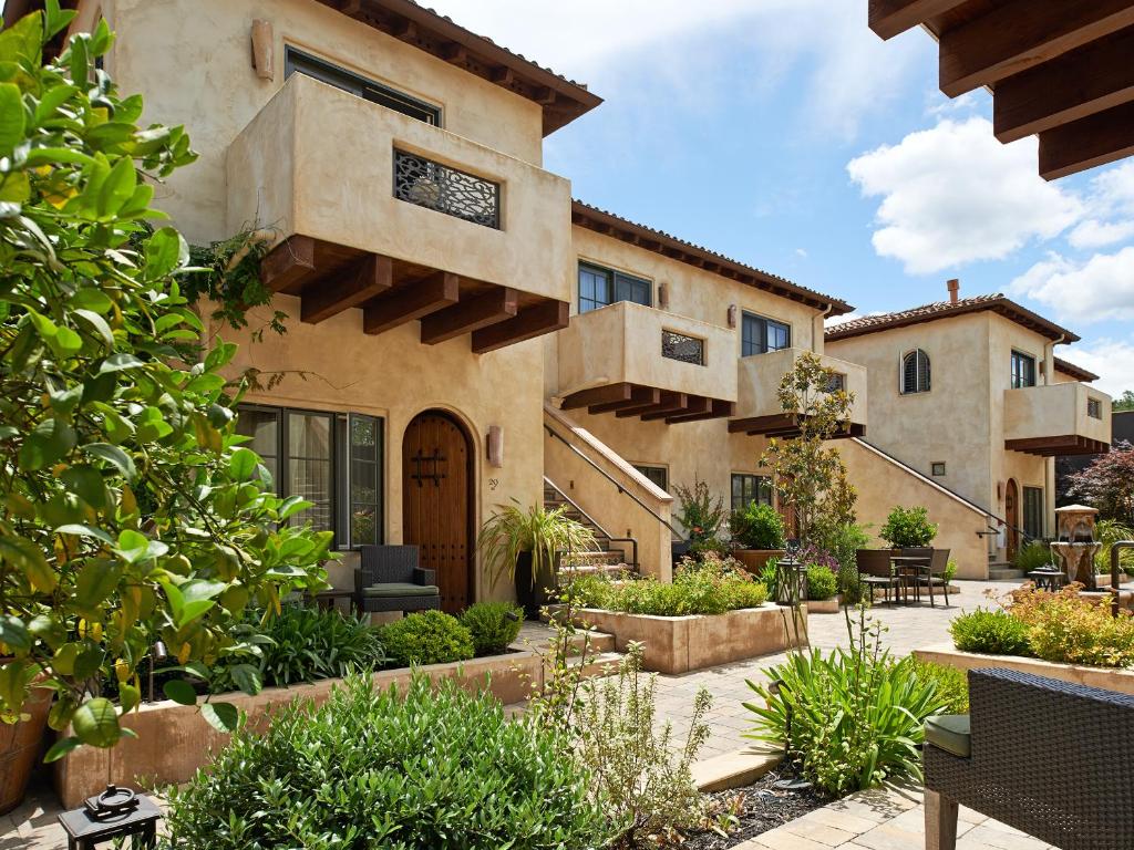 an exterior view of a house with a courtyard at North Block Hotel in Yountville