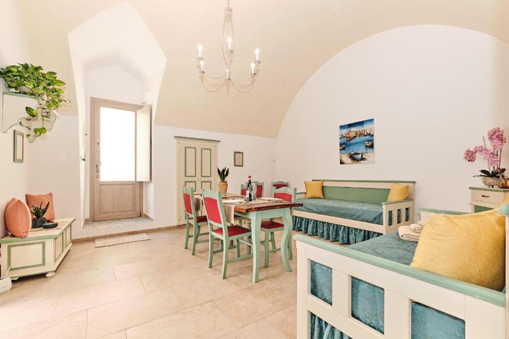 a living room with a couch and a table at SIGNURIA APARTMENT in Gallipoli