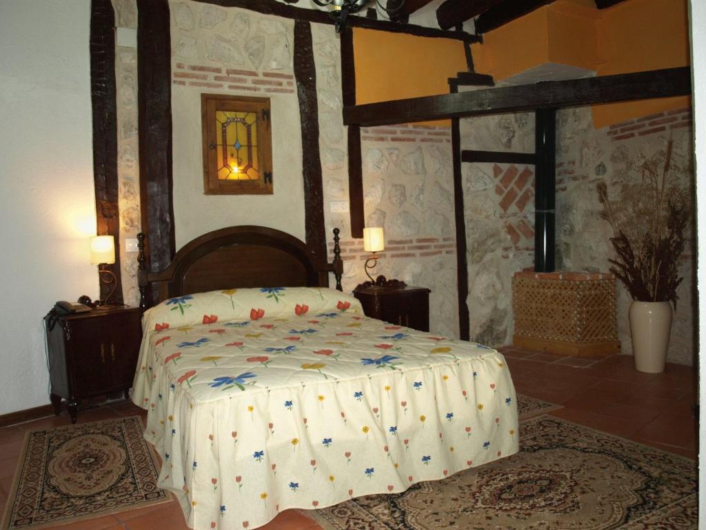 Postel nebo postele na pokoji v ubytování Gran Posada La Mesnada