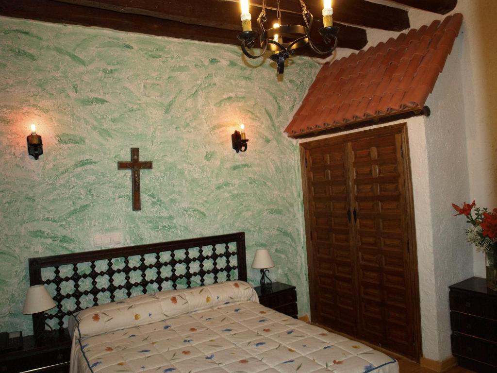 Postel nebo postele na pokoji v ubytování Gran Posada La Mesnada