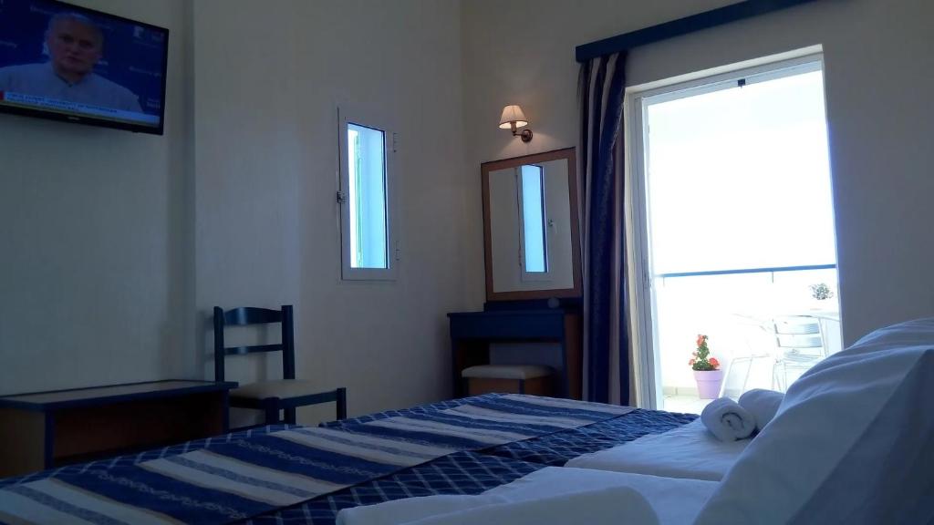 Łóżko lub łóżka w pokoju w obiekcie Porto Skala Village Hotel