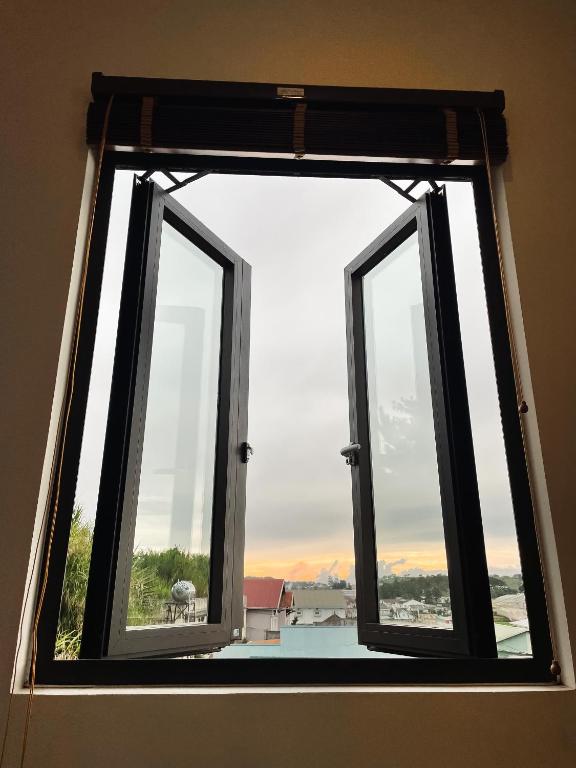 a window in a room with a view at Villa Délight House “Stay&Chill” in Da Lat