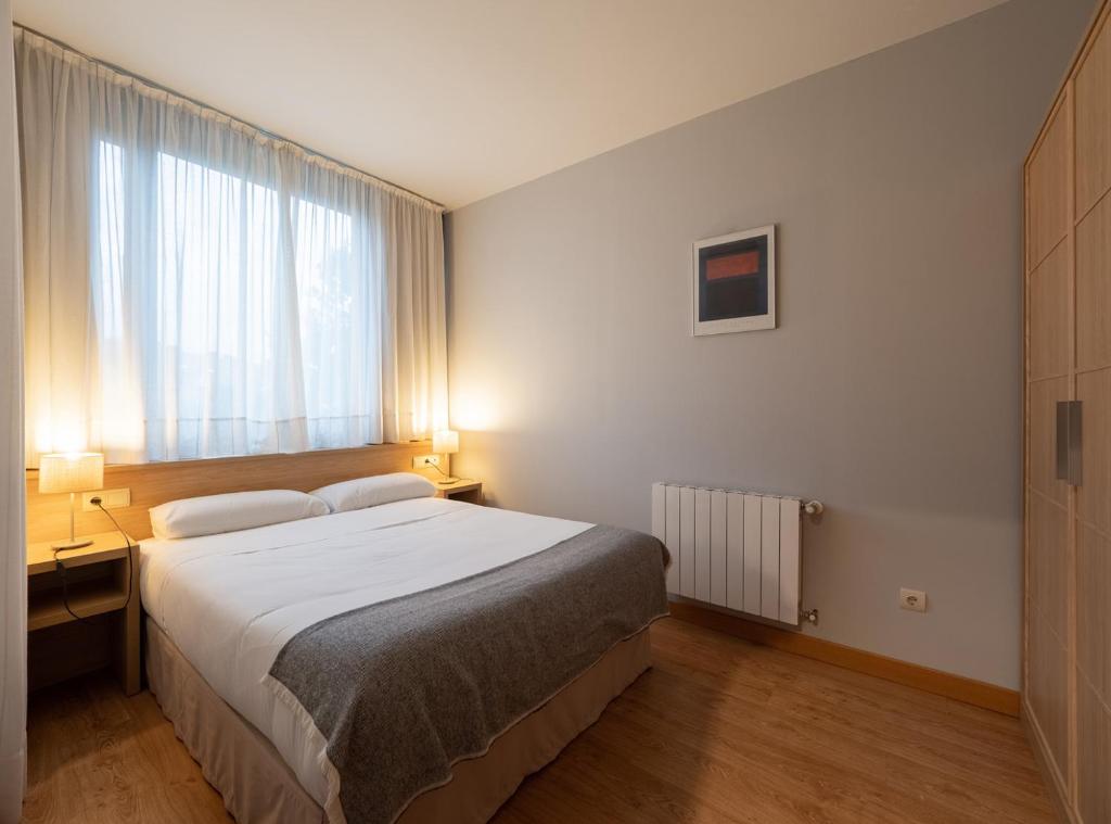 Postel nebo postele na pokoji v ubytování Posada La Robla