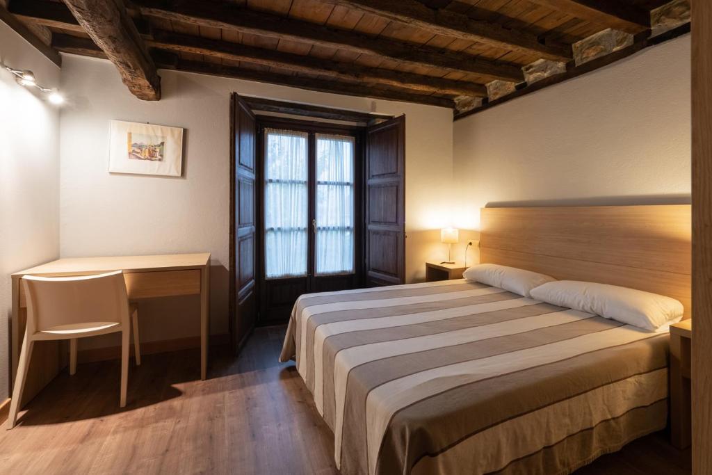 Postel nebo postele na pokoji v ubytování Posada La Robla