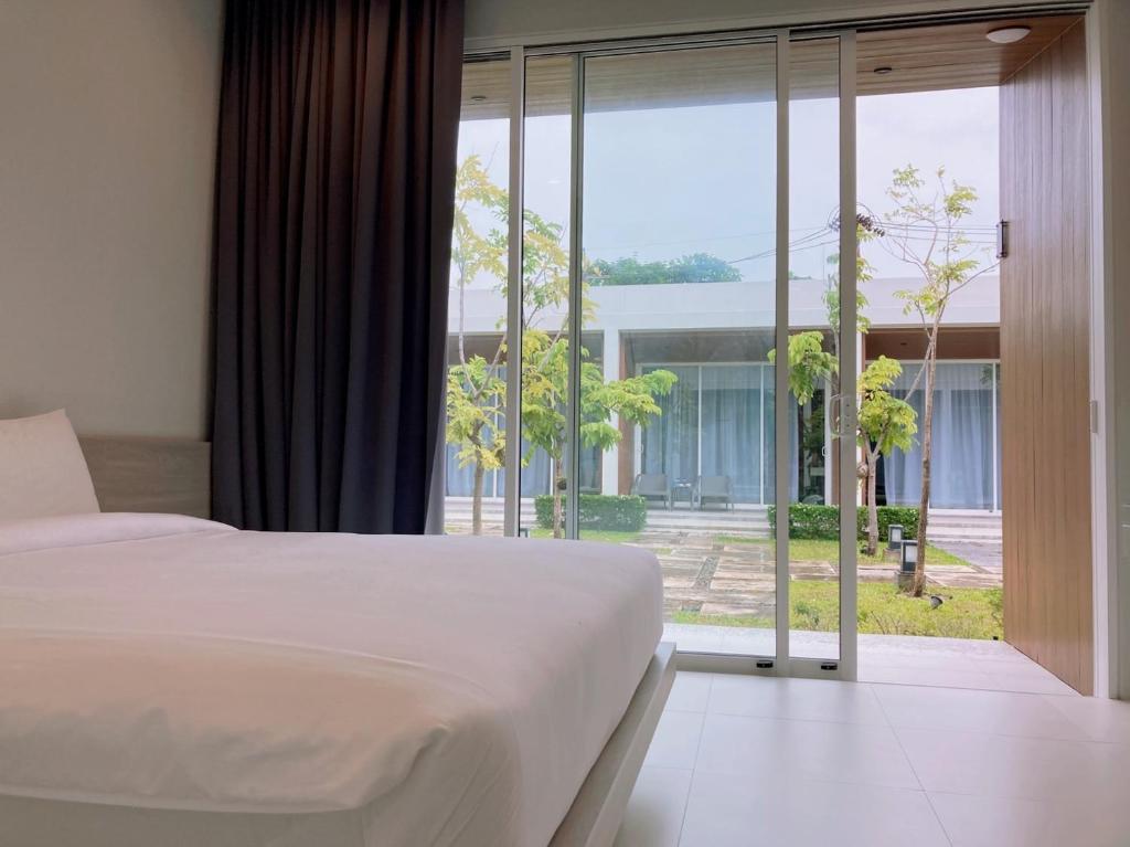 Postel nebo postele na pokoji v ubytování Baanfah Resort Samui