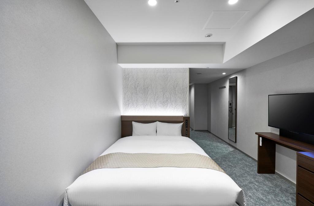 TV a/nebo společenská místnost v ubytování Daiwa Roynet Hotel Sapporo Nakajima Koen