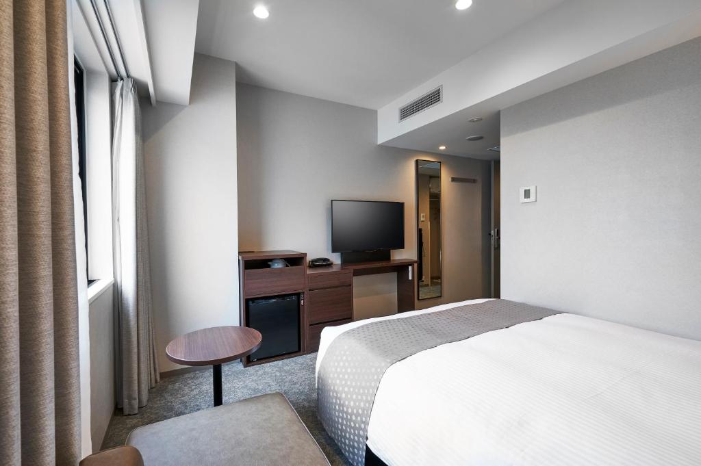 TV a/nebo společenská místnost v ubytování Daiwa Roynet Hotel Sapporo Nakajima Koen