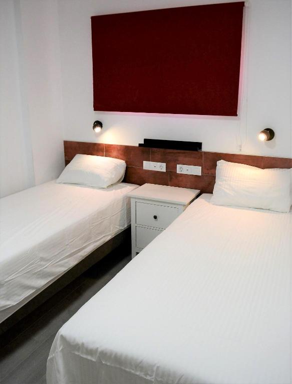 Postel nebo postele na pokoji v ubytování PALMENGARTEN APARTMENT Los Molinos