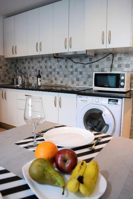 Kuchyň nebo kuchyňský kout v ubytování PALMENGARTEN APARTMENT Los Molinos