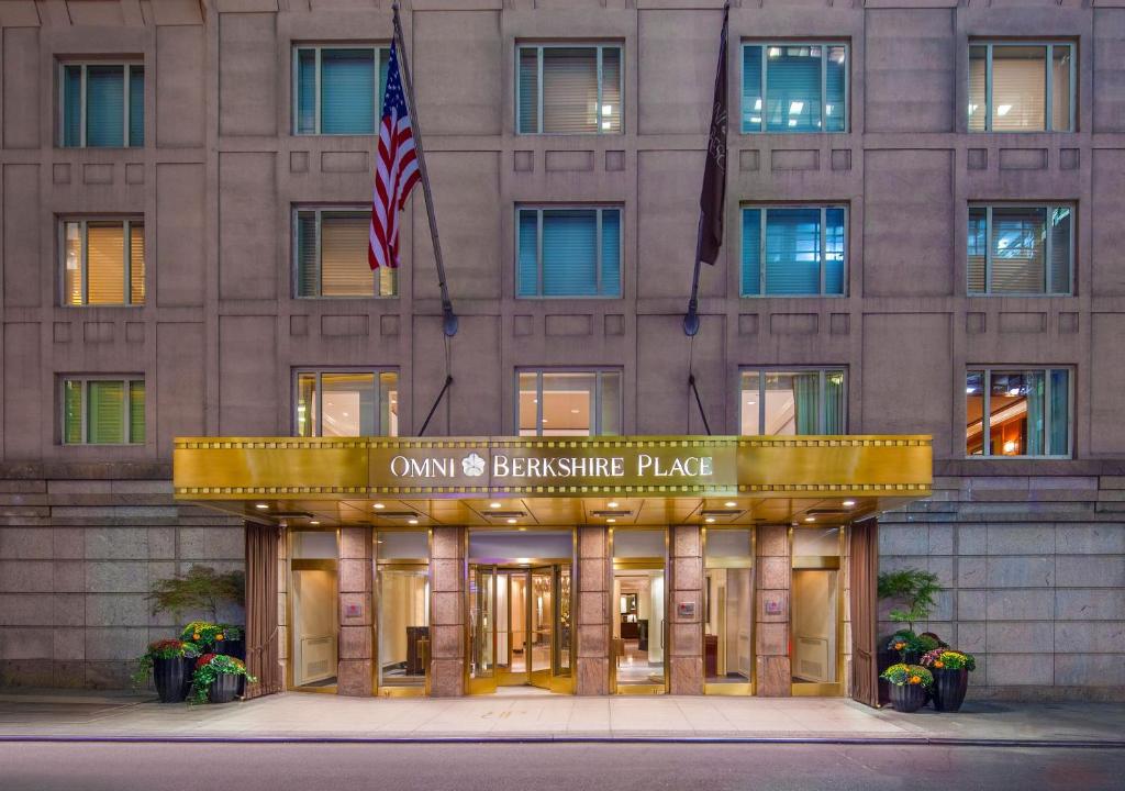 a building with a sign on the side of it at Omni Berkshire Place in New York