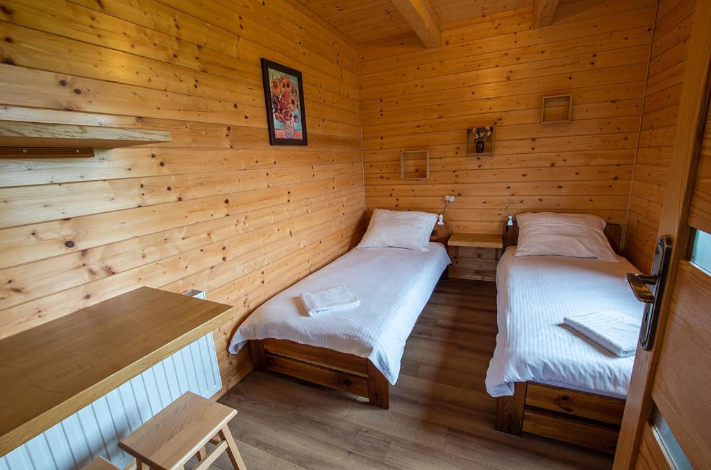 Posteľ alebo postele v izbe v ubytovaní Tarnawianka Apart