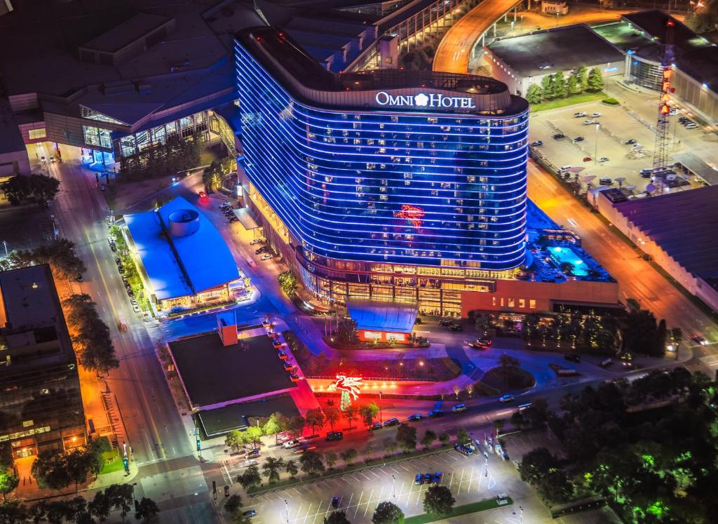 an aerial view of the ovation hotel at night at Omni Dallas Hotel in Dallas