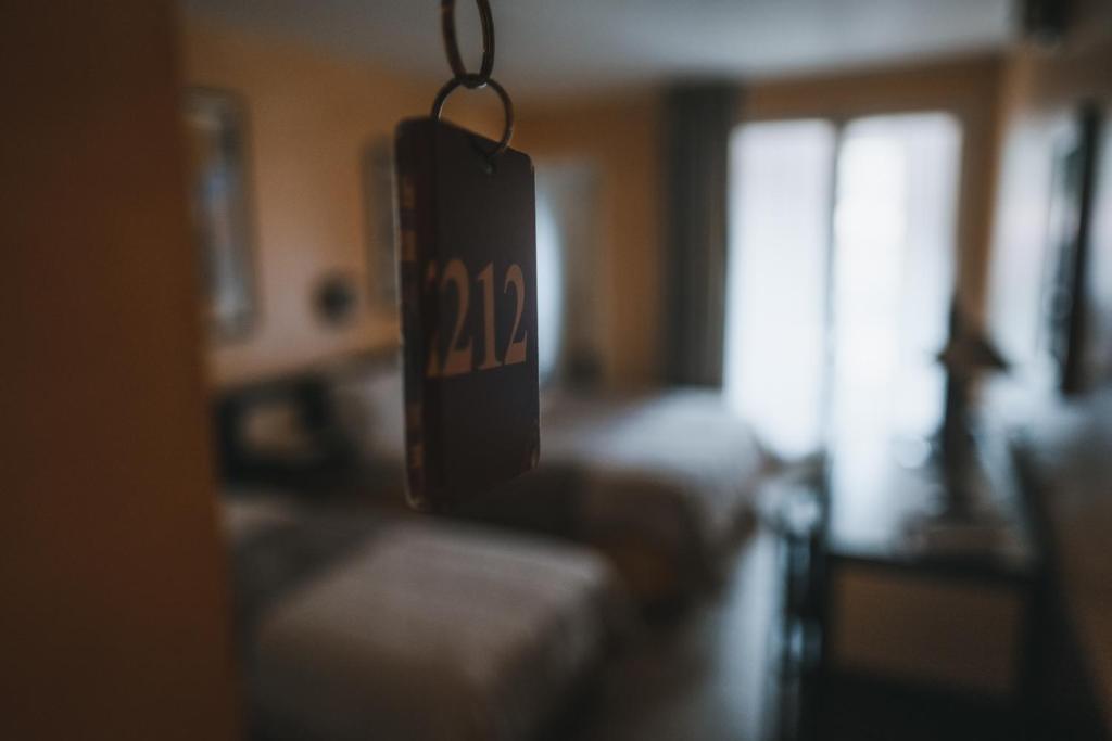 Postel nebo postele na pokoji v ubytování Hôtel & Résidence Le Subrini