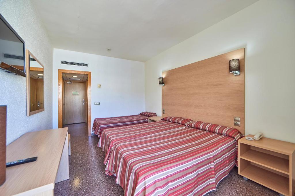Postel nebo postele na pokoji v ubytování Ona Don Juan