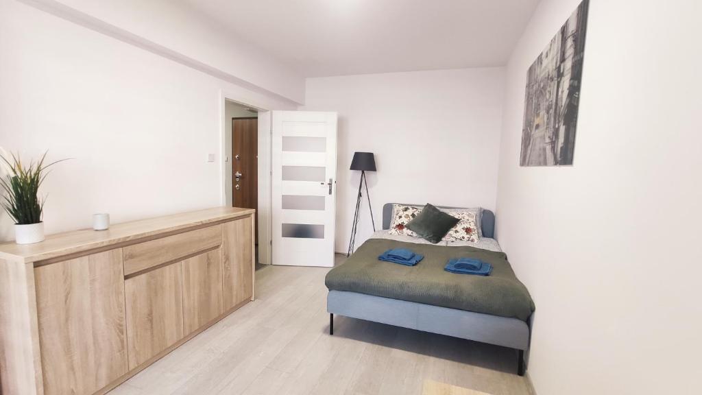 Posteľ alebo postele v izbe v ubytovaní Dąbska 18D by Homeprime