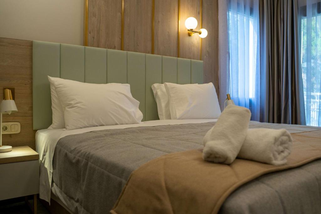 Postel nebo postele na pokoji v ubytování Tosca Beach Hotel