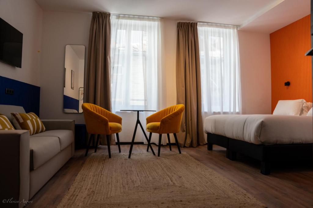 Postel nebo postele na pokoji v ubytování ClapClap Hôtel, Food & Bar
