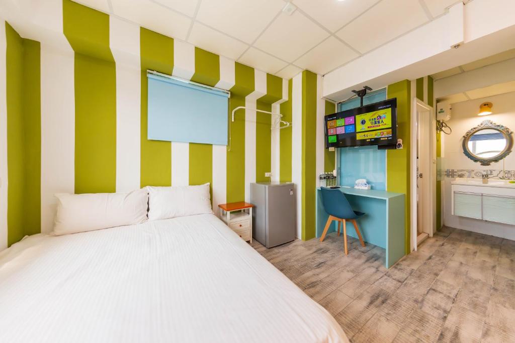 Postel nebo postele na pokoji v ubytování Liu He Su Hotel