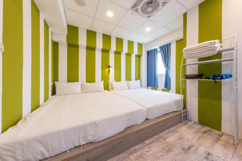 Postel nebo postele na pokoji v ubytování Liu He Su Hotel