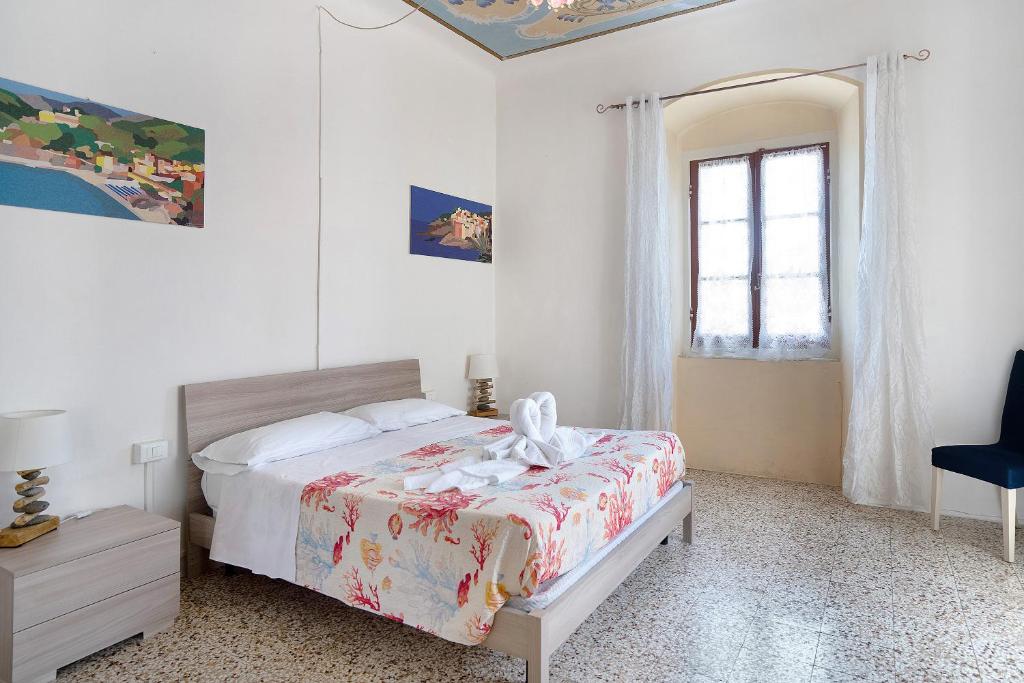 Posteľ alebo postele v izbe v ubytovaní Acciuga House