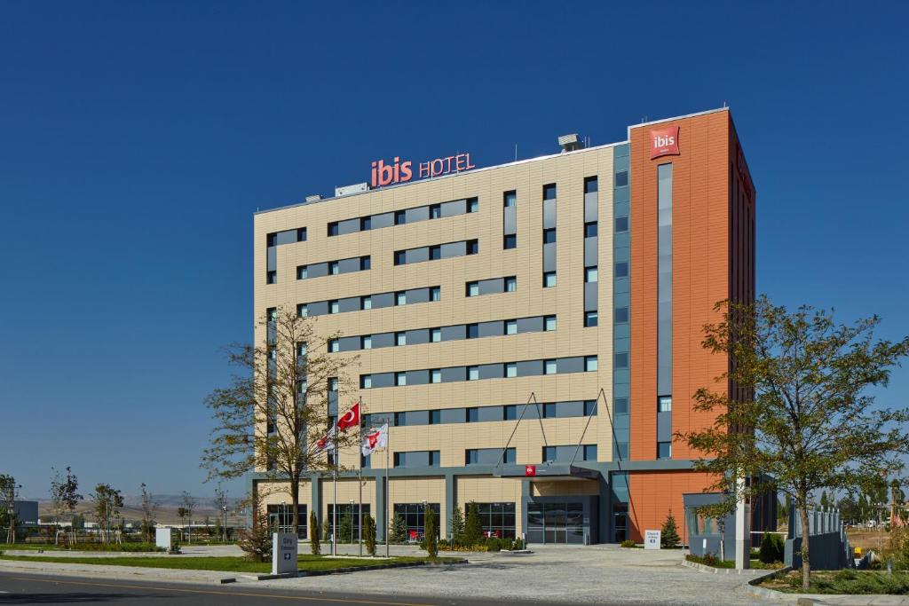 a building with a us hotel sign on top of it at ibis Ankara Airport Hotel in Ankara