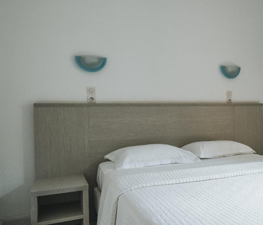 Postel nebo postele na pokoji v ubytování Hôtel Idéal