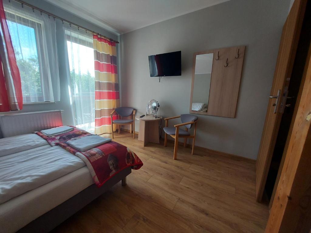 Posteľ alebo postele v izbe v ubytovaní Pokoje Gościnne Maczek