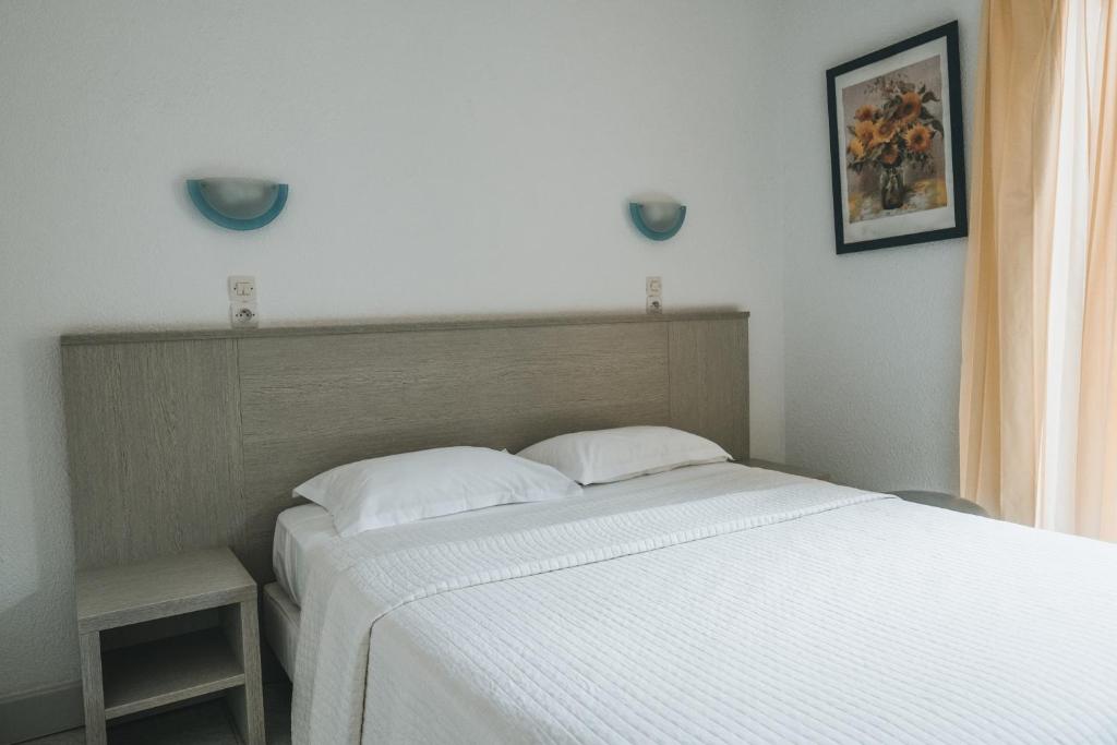 Postel nebo postele na pokoji v ubytování Hôtel Idéal