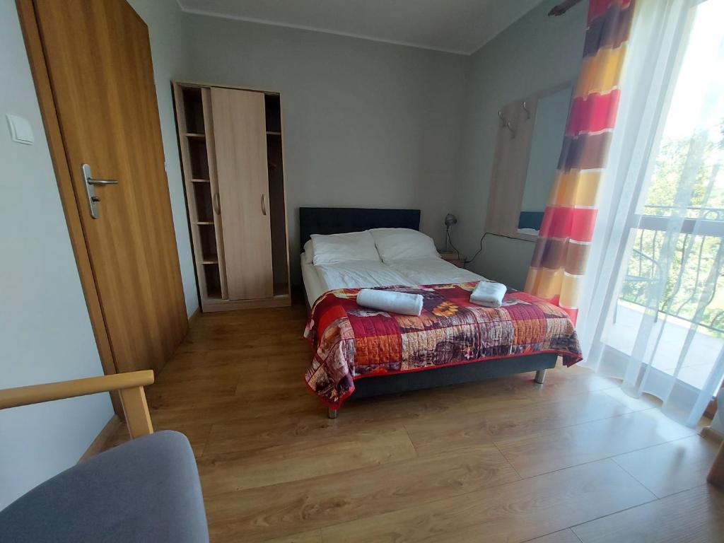 Posteľ alebo postele v izbe v ubytovaní Pokoje Gościnne Maczek