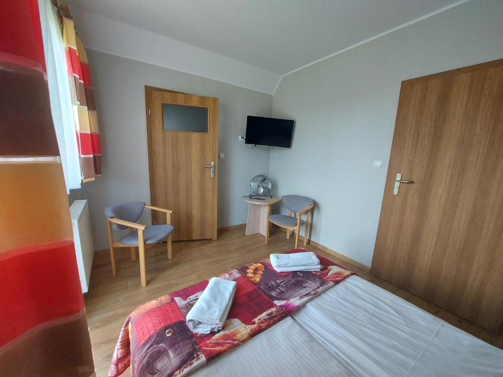 Posteľ alebo postele v izbe v ubytovaní Pokoje Gościnne Maczek