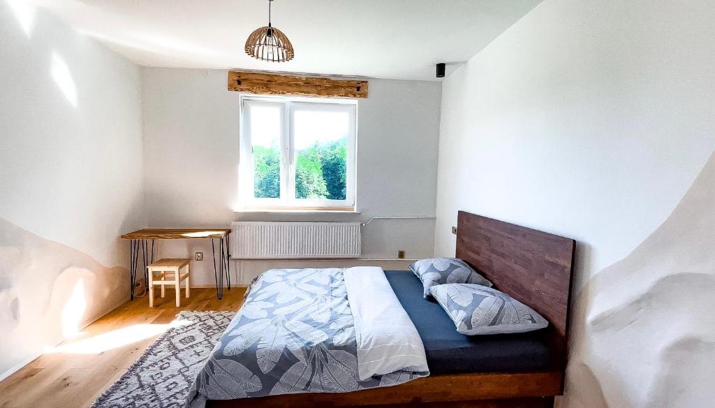 Postel nebo postele na pokoji v ubytování Bieszczady Guest House