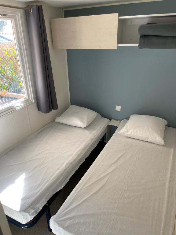 Postel nebo postele na pokoji v ubytování Camping la Paoute