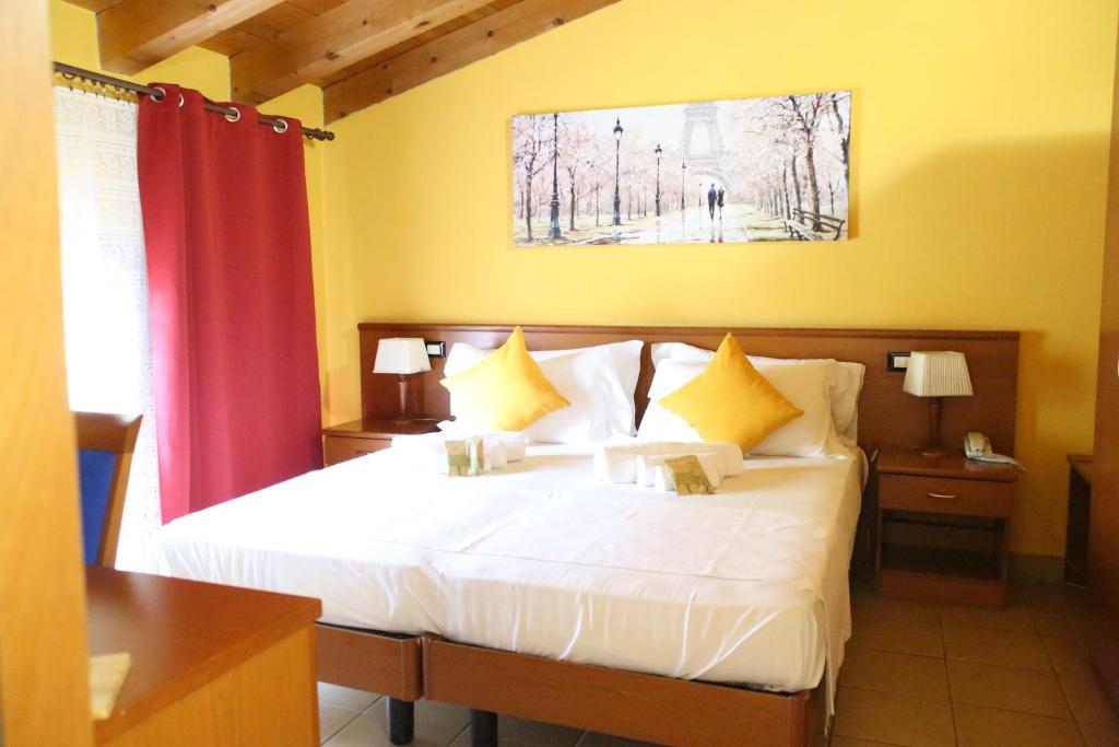 Postel nebo postele na pokoji v ubytování Hotel Al Bosco