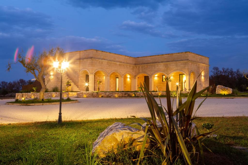 a building with a street light in front of it at TENUTA DOROLIVO in Otranto
