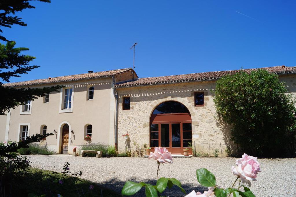 an external view of a large stone building at Chateau Le Livey in Saint-Pierre-dʼAurillac