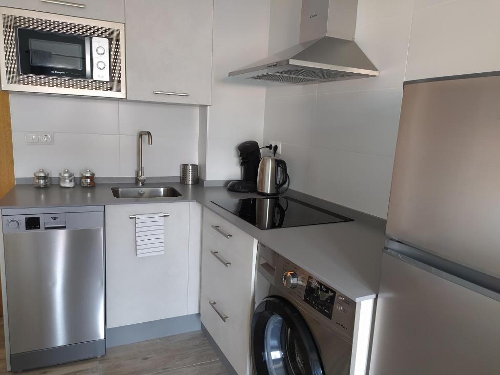 Kuchyňa alebo kuchynka v ubytovaní Apartamento Victoria Plaza