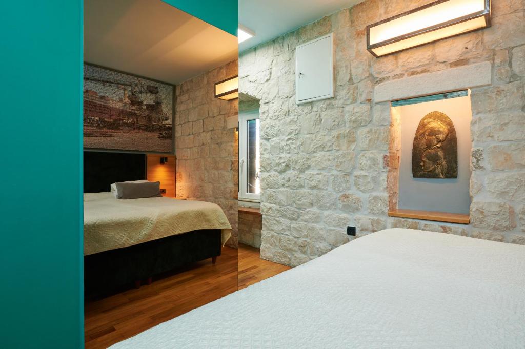 Postel nebo postele na pokoji v ubytování Domus Maritima
