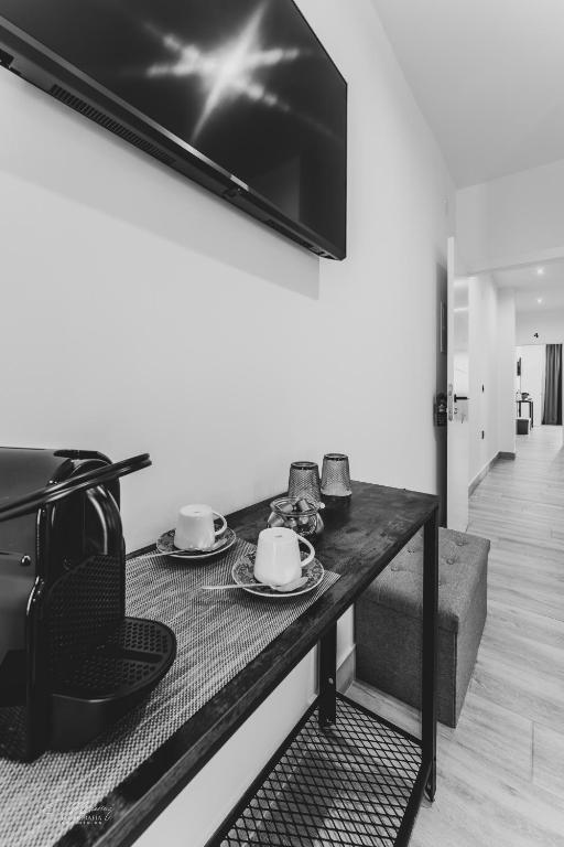 A television and/or entertainment centre at La Posada del Teatro H Boutique Parking Gratis