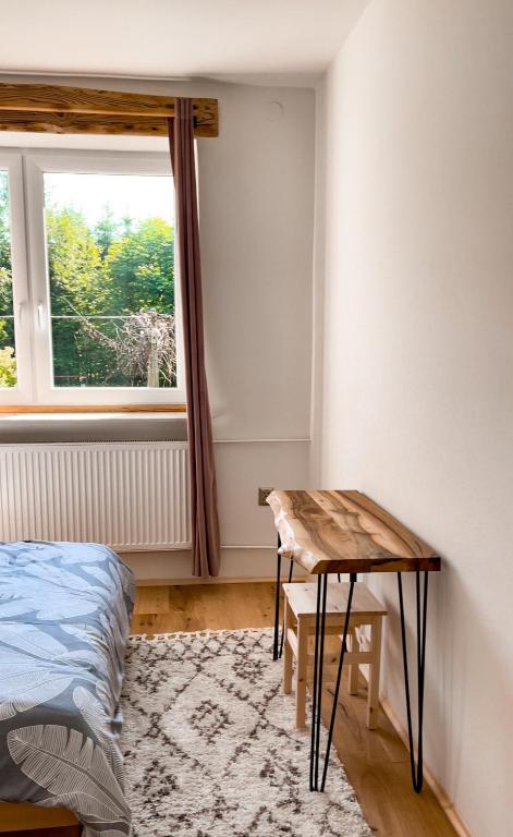 Postel nebo postele na pokoji v ubytování Bieszczady Guest House