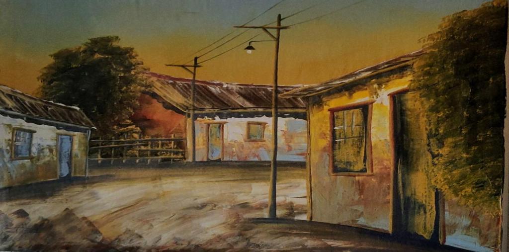 an oil painting of a building with a street light at Turpino House in Vilar Torpim