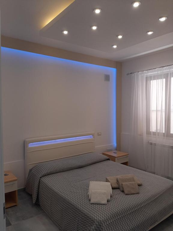 Terra di mare apartment & management tesisinde bir odada yatak veya yataklar