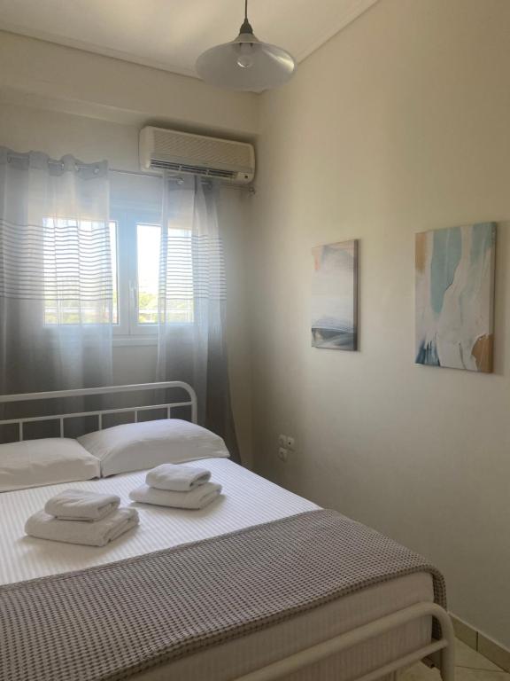 Postel nebo postele na pokoji v ubytování DiFan Sea Homes A5