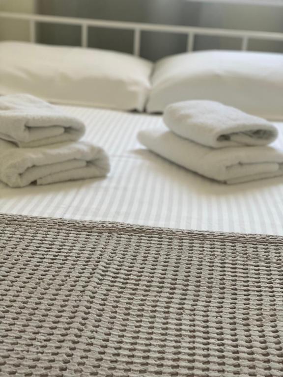 Postel nebo postele na pokoji v ubytování DiFan Sea Homes A5